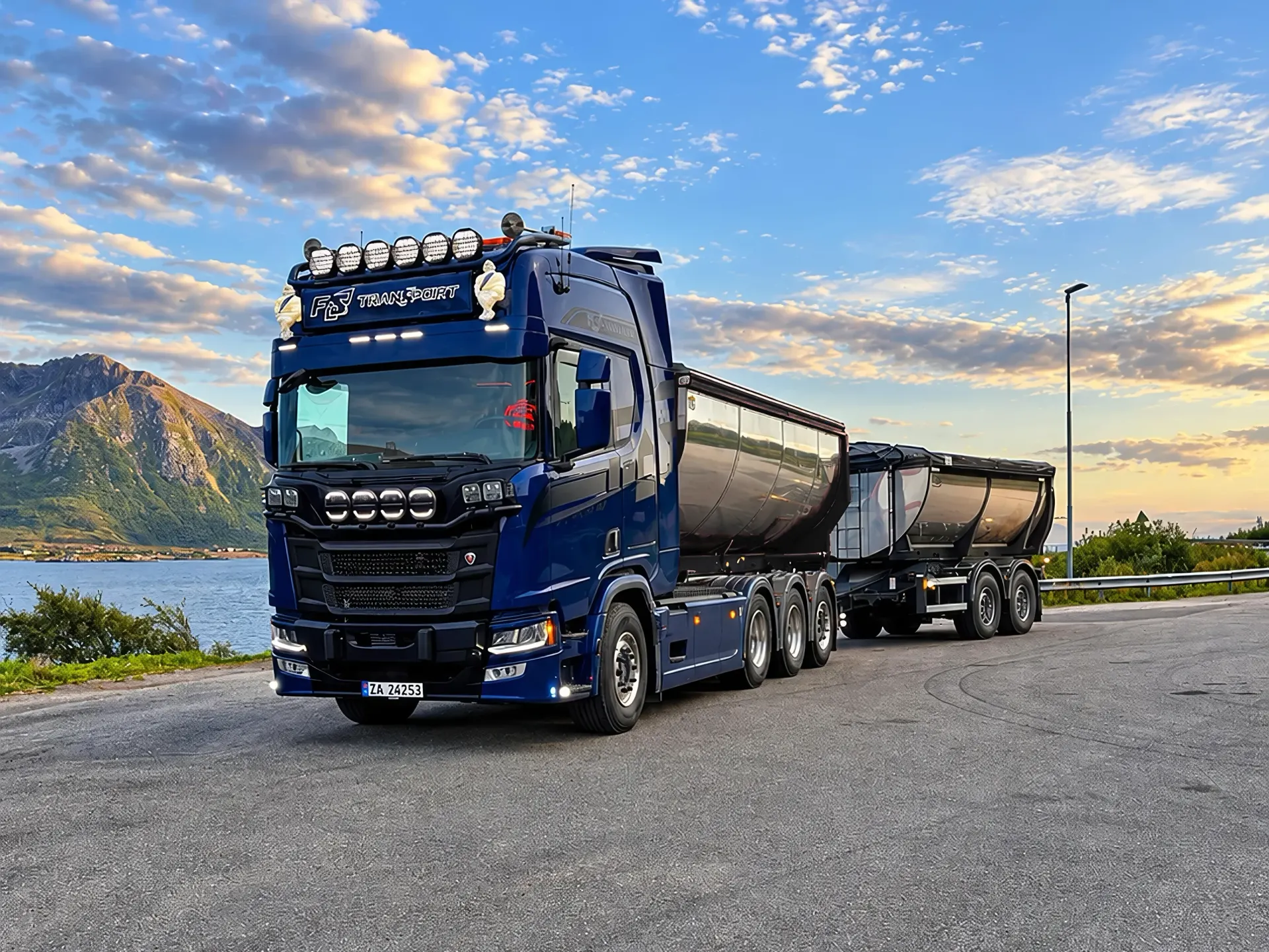 Blå Scania med henger ved fjorden i kveldslys